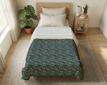 May include: A twin-sized bed with a teal and green patterned comforter. The bed has a light wood headboard and is made up with white sheets and pillows. A potted plant and a small side table with a lamp are visible.