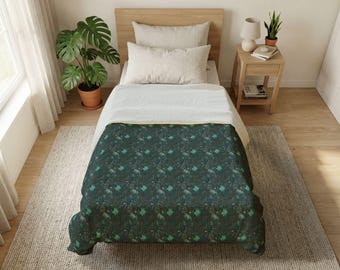 May include: A bed with a dark green patterned comforter. The comforter has a repeating pattern of teal and green shapes. The bed has a light wood headboard and a white top sheet. A potted plant sits on the floor next to the bed.