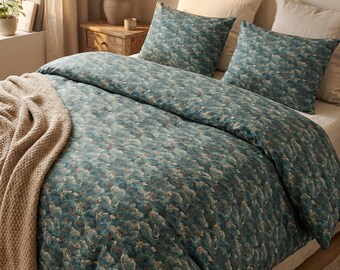 May include: A bedding set featuring a dark teal duvet cover and two matching pillowcases with a repeating pattern of stylized ocean waves in shades of blue, green, and cream. A beige knit throw blanket with fringe is draped over the side of the bed.