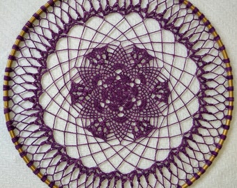 May include: A purple crocheted dreamcatcher with a gold metal hoop.