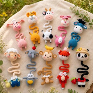 May include: A collection of colorful, handmade crochet animal toys, including a tiger, cow, bunny, sheep, elephant, monkey, fox, and panda. Each toy has a unique design and is connected to a long, flexible body. The toys are arranged on a cream-colored surface.