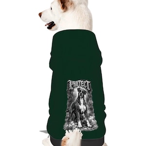 May include: A dark green dog sweater featuring a black and white graphic of a dog with the word "PROTECT" above it. The sweater is designed to fit a dog and has a black band at the bottom.