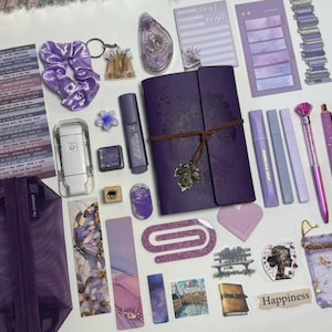 May include: A trio of ceramic mugs with a speckled, matte finish in cream, light grey, and dark grey. Each mug features a simple, minimalist design, ideal for tea or coffee.