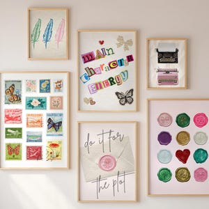 May include: A collection of framed art prints. One print features three colorful feathers. Another displays a collage of stamps with butterflies and flowers. Other prints include text, a butterfly, and wax seals.