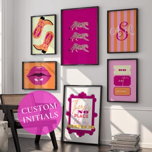 May include: A gallery wall set of six framed prints featuring a pair of orange cowboy boots, three pink leopards, a monogram with the letters ASL, a pair of pink lips, three ticket stubs with the text DO NOT DISTURB, and a sign reading There's NO PLACE like my ROOM.