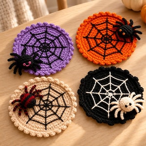 May include: Four round crochet coasters featuring Halloween themes. One purple with a black spider web and black spider, one orange with a black web and spider, one beige with a black and red spider, and one black with a white web and white spider.