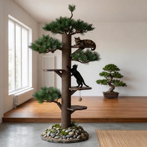 May include: A cat tree designed to resemble a pine tree, with multiple platforms and faux foliage. Two cats are on the tree, one black and one tabby. The base is surrounded by stones and moss.