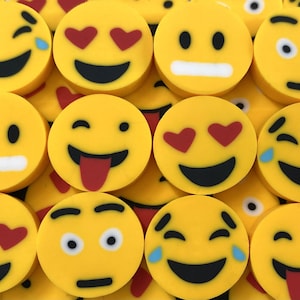 May include: A collection of yellow emoji-faced circles with various expressions. Some have hearts for eyes, others show tears, a tongue sticking out, or a simple smile. The emojis are arranged closely together.