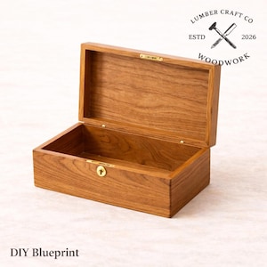 May include: Open wooden box with a hinged lid, featuring a brass clasp and lock. The box is made of a warm-toned wood, with visible grain patterns. The text "Lumber Craft Co Woodwork" and "DIY Blueprint" are visible.