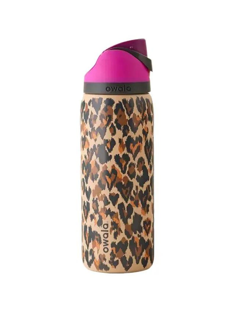 May include: A stainless steel Owala water bottle with a pink lid and a tan body featuring a brown and black leopard print pattern. The bottle has a black handle and the brand name "owala" is printed on the bottle.