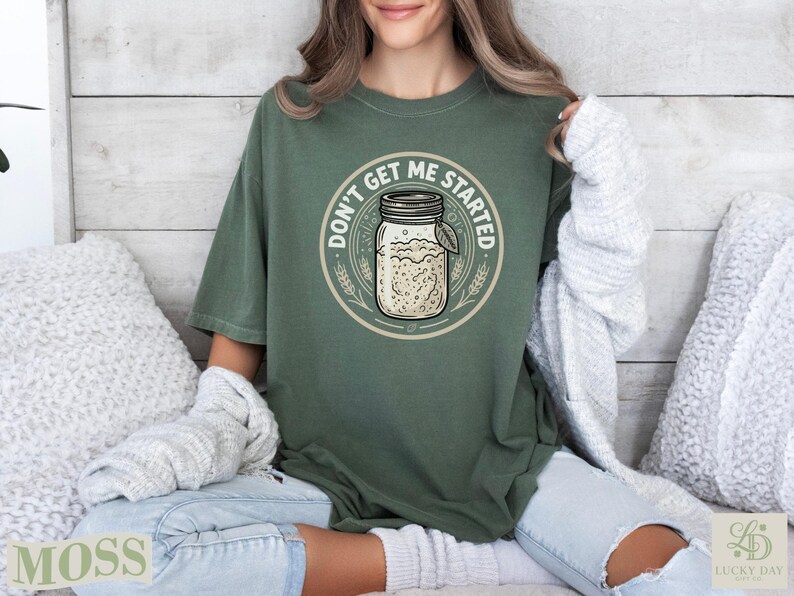 Green t-shirt with "Don't get me started" text and a jar graphic.