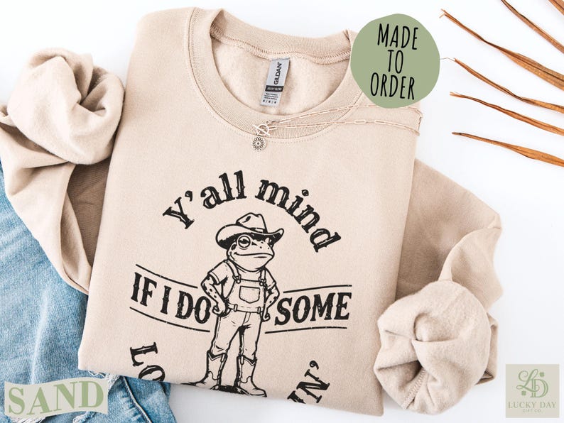 Beige Gildan sweatshirt with frog graphic and "Y'all mind if I do some" text.