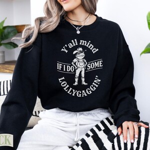 Black sweatshirt with text "Y'all mind if I do some lollygaggin'".