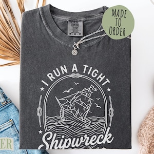 Comfort Colors t-shirt with "I Run A Tight Shipwreck" graphic.