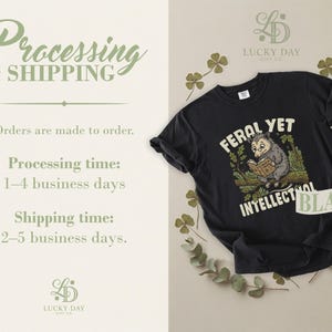 Black t-shirt with "Feral Yet Tales & Trivia" text and possum graphic.