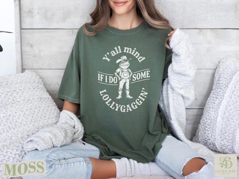 Green t-shirt with "Y'all mind if I do some lollygaggin'" text and frog graphic.