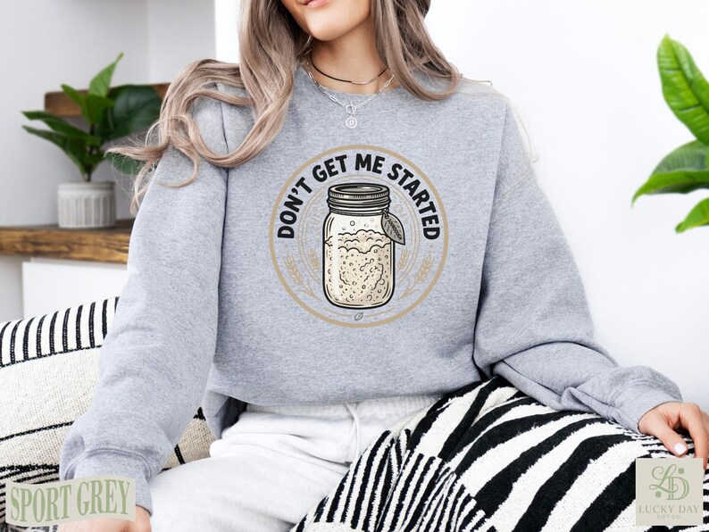 Grey sweatshirt with "Don't Get Me Started Sourdough" graphic featuring a jar.