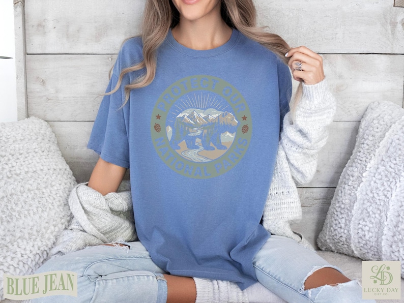 Blue t-shirt with a "Protect Our National Parks" circular graphic featuring a bear and mountains.