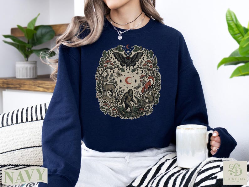 Navy crewneck sweatshirt with woodland creature circle design.