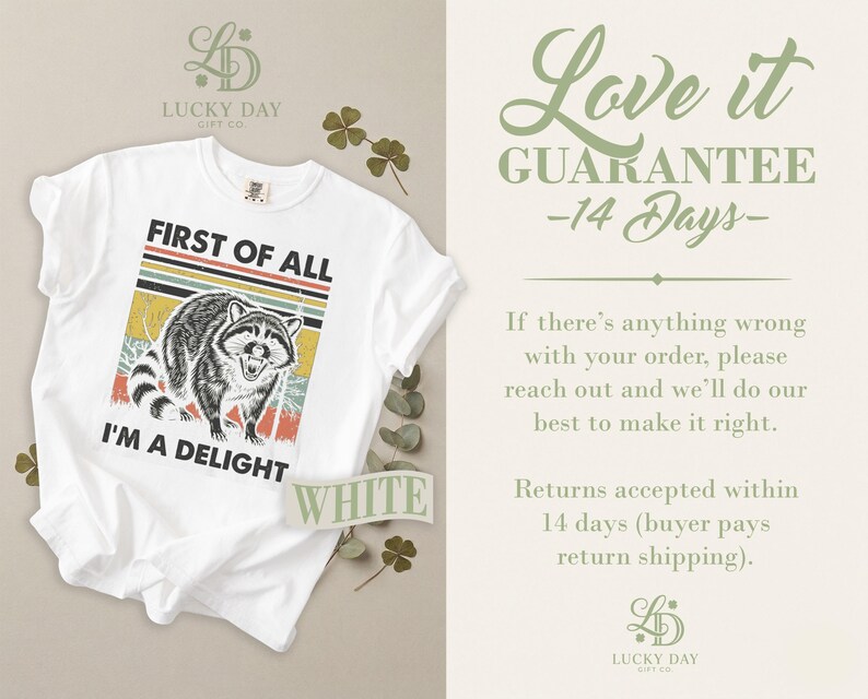 White t-shirt with raccoon graphic and "I'M A DELIGHT" text.