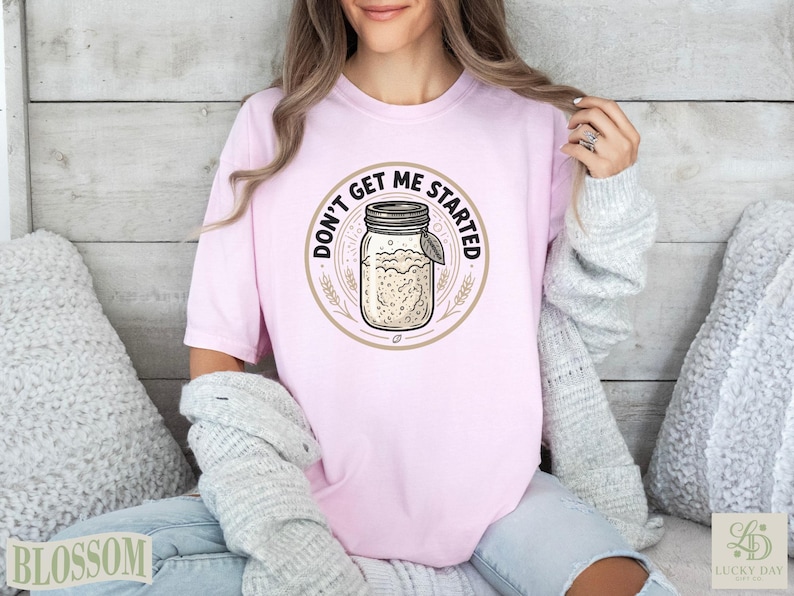 Pink t-shirt with "Don't Get Me Started" text and a mason jar graphic.