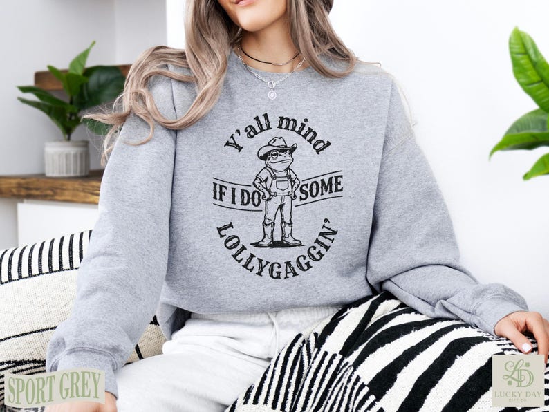 Grey sweatshirt with "Y'all mind if I do some lollygaggin'" graphic.