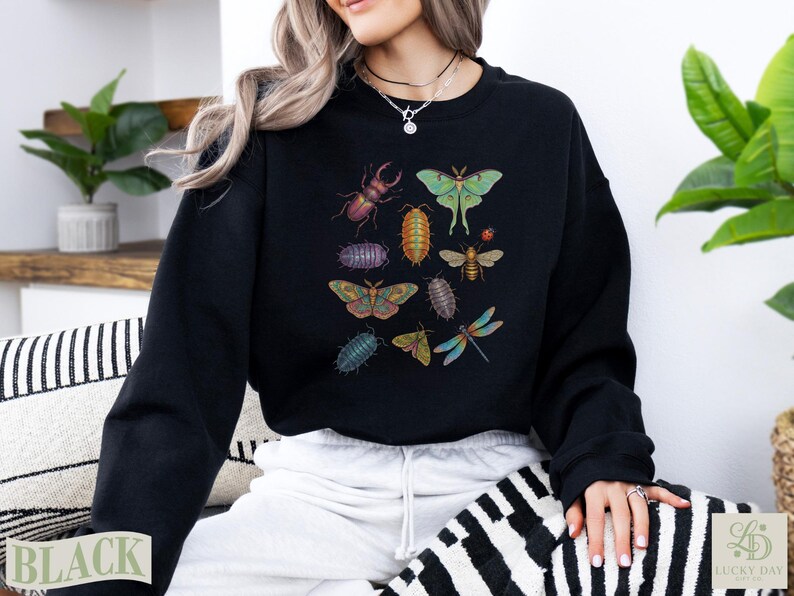 Black sweatshirt with various illustrated insects including a beetle, moth, and dragonfly.