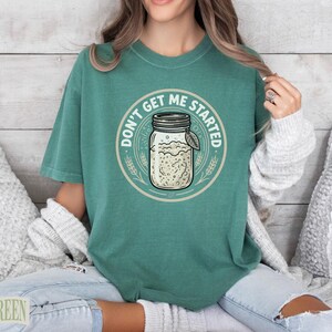 T-shirt with "Don't Get Me Started" text and a canning jar graphic.