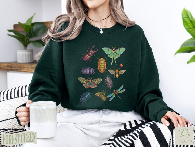 Dark green crewneck sweatshirt featuring various insects in a collage.