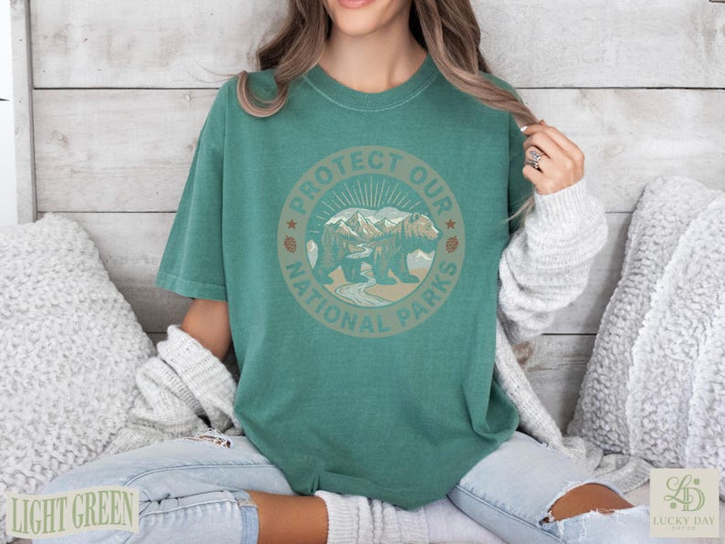 Green t-shirt with "Protect Our National Parks" circular graphic featuring a bear.
