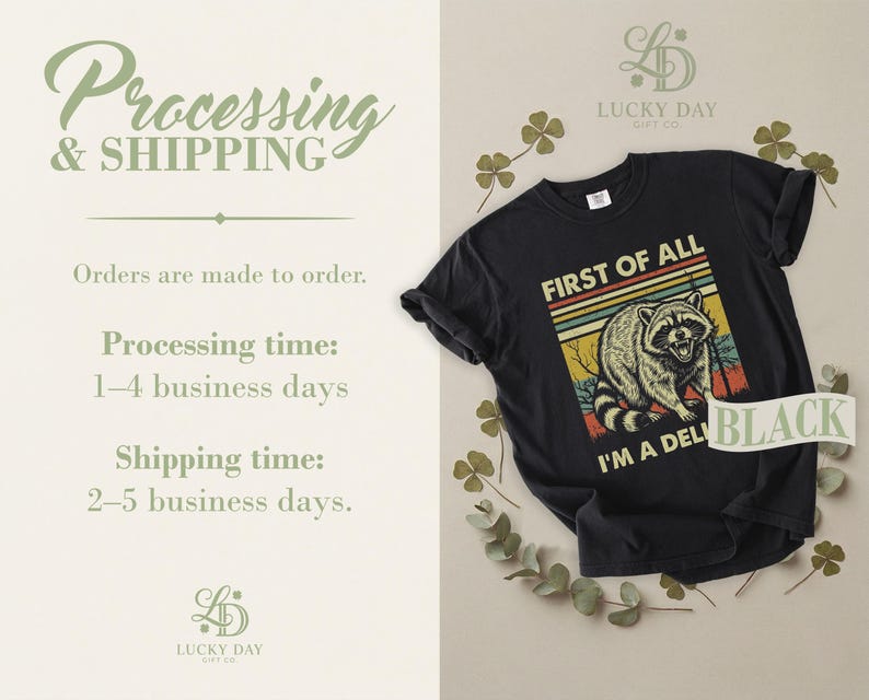 Black t-shirt with raccoon graphic and text "First of all, I'm a deli black".