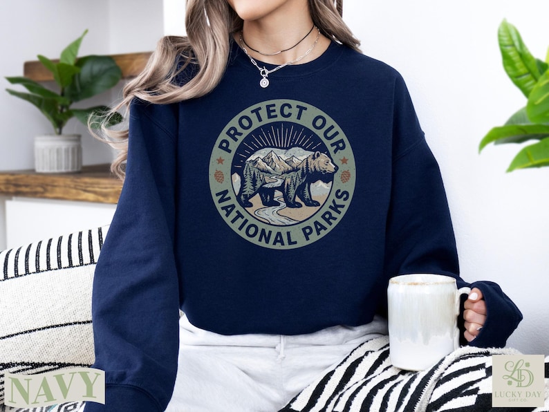 Navy sweatshirt with "Protect Our National Parks" circular graphic featuring a bear.