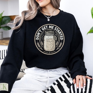 Black sweatshirt with "Don't Get Me Started" sourdough graphic.
