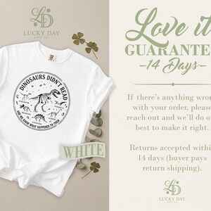 White t-shirt with dinosaur graphic and "Love it Guarantee" text.
