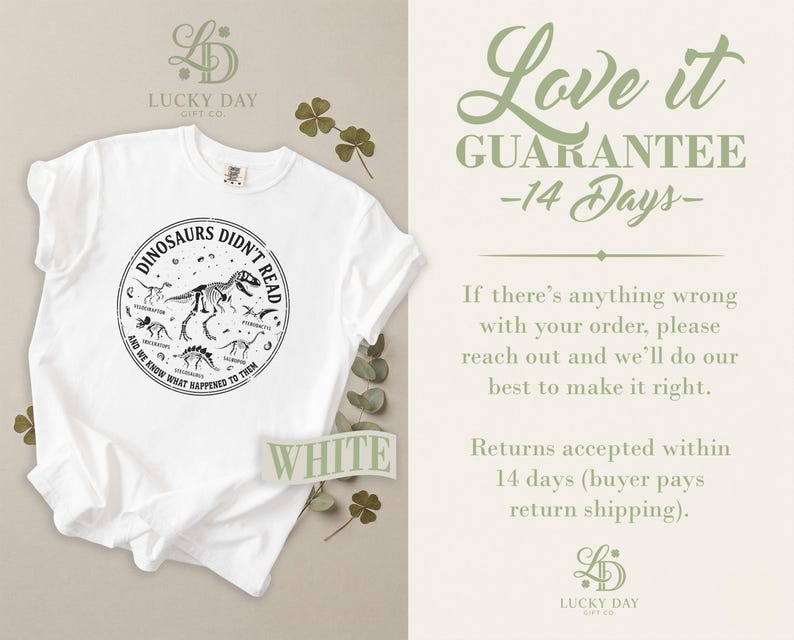 White t-shirt with dinosaur graphic and "Love it Guarantee" text.
