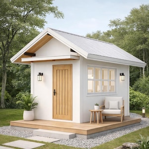 May include: A small, white cabin with a light gray metal roof and a wooden door and deck. The cabin has a window, a chair, and a small table on the deck. A potted plant sits near the door, and a pathway leads to the cabin.