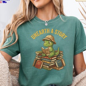 Comfort Colors® Retro Unearth a Story Shirt, Cute Dinosaur Reading Tee, Book Lover Graphic Tshirt, Reading Teacher Gift, Aesthetic Dino Top