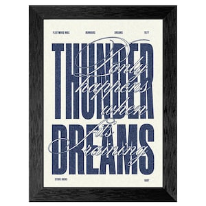 May include: Framed art print with a black wooden frame. The print features the text "Thunder Only Happens When Dreams Are Raining" in navy blue and white, with the words "Fleetwood Mac", "Rumours", "Dreams", and "1977" at the top.