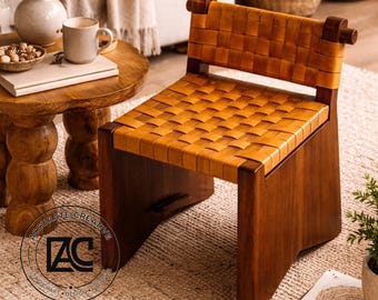 Sillón auxiliar de cuero tejido a mano: Estructura de madera maciza, diseño rústico moderno.