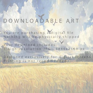 Golden Wheat Field With Birds Printable Wall Art framed and propped on a wooden bench with neutral decor
