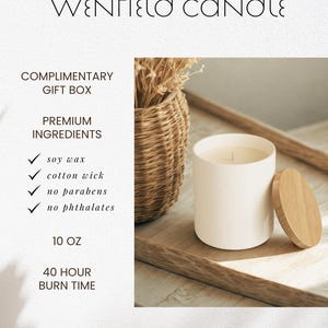 May include: A white cylindrical candle with a wooden lid, next to a woven basket with dried plants. The candle is 10 oz and has a 40-hour burn time. The text on the image says "WENFIELD CANDLE".