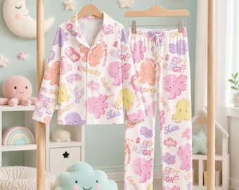 Conjunto de pijama infantil: pijama suave con estampado de dibujos animados, pijama de algodón con botones, ropa de dormir cómoda de manga larga para niños y niñas.