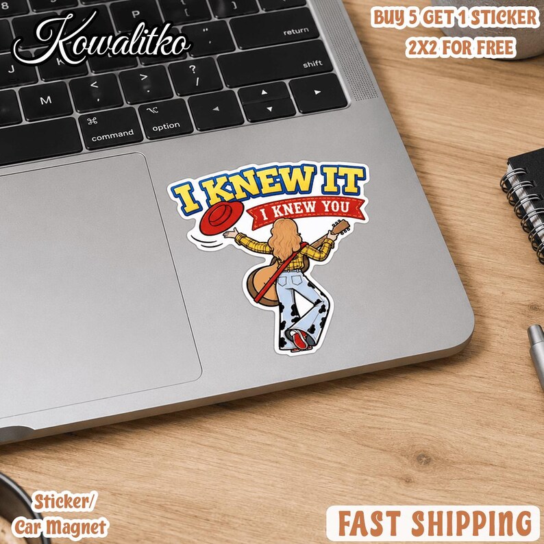 May include: A die-cut sticker featuring a cartoon figure with long hair wearing a yellow plaid shirt and cow-print bell-bottom pants, holding a guitar and a red hat. The text reads I KNEW IT I KNEW YOU in blue and red against a white background.
