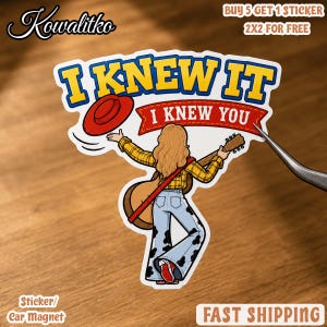 May include: A die-cut sticker featuring a person with long blonde hair wearing a yellow plaid shirt and cow-print bell-bottom pants, holding an acoustic guitar and a red hat. The text reads I KNEW IT I KNEW YOU in blue and white lettering.
