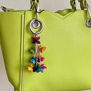 Keke’s leather tassely flower keychain, zipper pull and purse charms - assorted colors