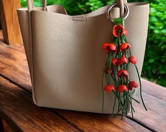 Cassidy’s Leather flower fringe purse charm in some colors