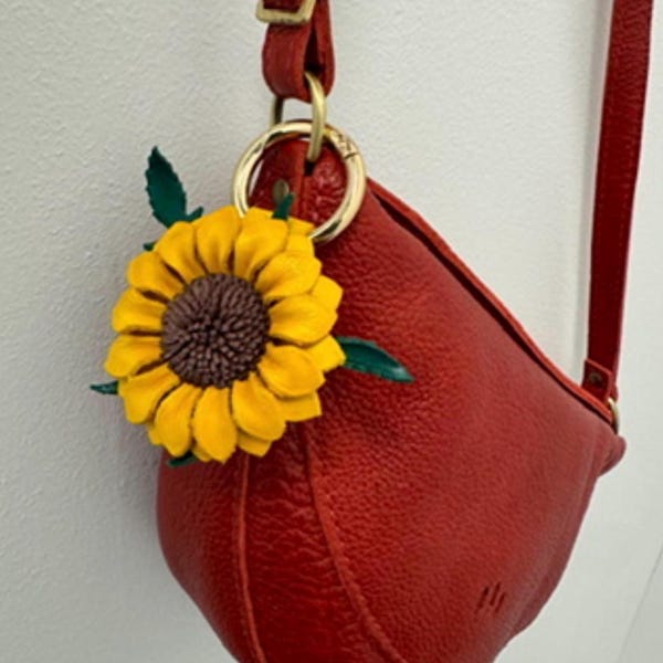 Joli porte-clés et breloque pour sac à main en cuir inspirés du tournesol, dans des couleurs amusantes assorties.