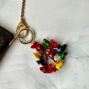 Keke’s leather tassely flower keychain, zipper pull and purse charms - assorted colors