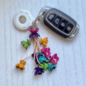 Keke’s leather tassely flower keychain, zipper pull and purse charms - assorted colors