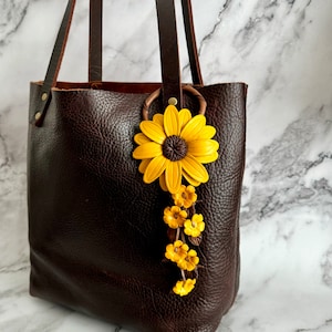 Megan’s leather big daisy  purse charm and keychain in yellow